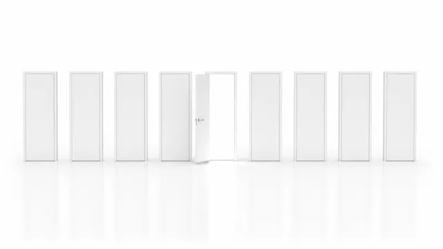 Nine tall white doors standing on a white floor, eight of them shut and one standing open onto light.