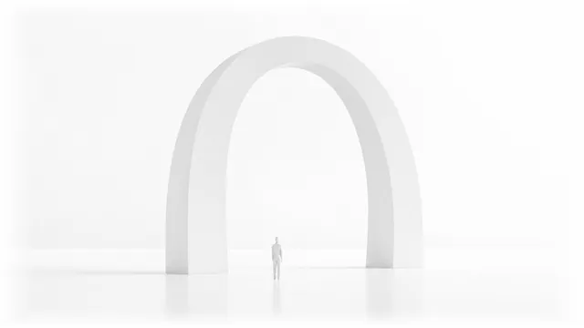 One small white figure stands alone beneath an immense white arch on an open white plane.