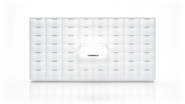 A wall of frosted-glass drawers in an even grid, every one shut flush except one pulled open and lit from inside.